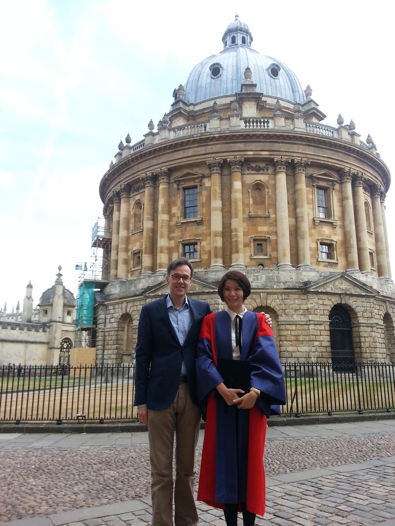 Image of Rebecca Wong with Professor Federico Varese outside of the Radcliffe Camera