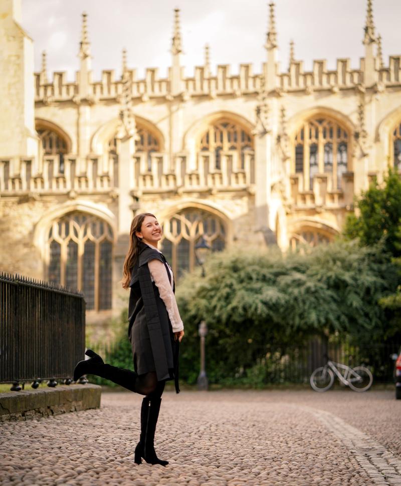 Image of Sarah Brand standing in Radcliffe Square after her Matriculation Ceremony